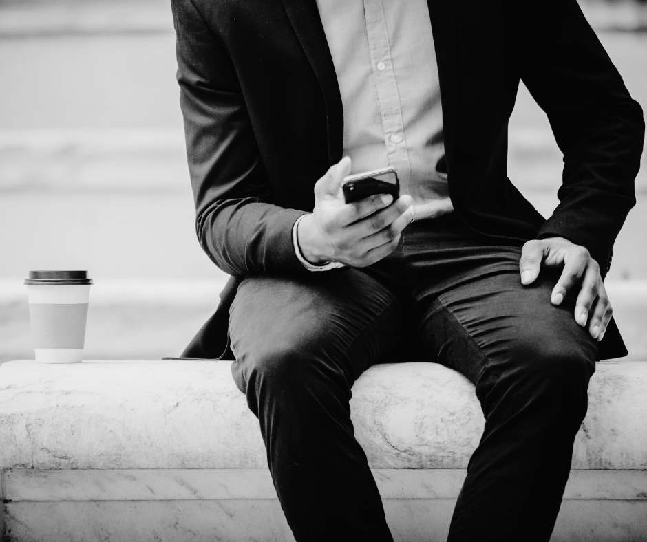 corporate male looking at phone