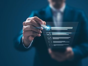 corporate man checking boxes